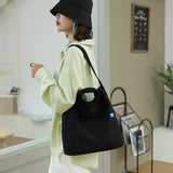 Black Minimalist Nylon Tote Bag with Adjustable Shoulder Strap, Large Capacity