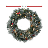 Jingle Jollys 60cm Illuminated Snow-Frosted Christmas Wreath with Red Berry Accents