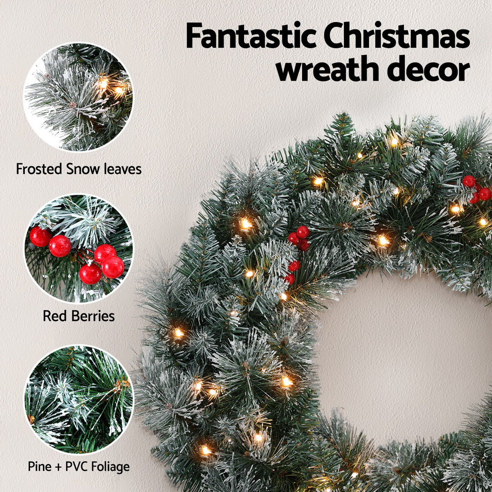 Jingle Jollys 60cm Illuminated Snow-Frosted Christmas Wreath with Red Berry Accents